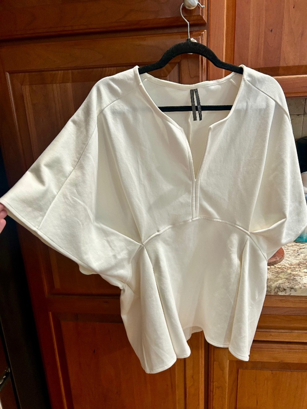 Anthropology size, extra large, batwing, very classy looking cream peplum top